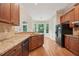 Eat-in kitchen featuring granite countertops, stainless steel appliances and backyard view at 223 Falling Water Way, Woodstock, GA 30188