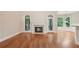 Spacious living room featuring hardwood floors, fireplace, and natural light at 223 Falling Water Way, Woodstock, GA 30188