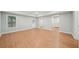 Spacious living room with hardwood floors and bright natural light at 223 Falling Water Way, Woodstock, GA 30188