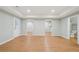 Open living room with new hardwood flooring, lighting, and paint at 223 Falling Water Way, Woodstock, GA 30188