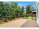 Spacious wooden back deck with dark railings overlooking the well-manicured lawn at 3710 Robinson Walk Ct, Marietta, GA 30068