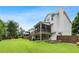 An expansive backyard with a firepit, deck, and screened in porch at 3710 Robinson Walk Ct, Marietta, GA 30068