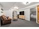 Finished basement offers a comfortable living area, entertainment center, and convenient wet bar for relaxation at 3710 Robinson Walk Ct, Marietta, GA 30068