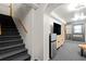 Carpeted basement with a wet bar, TV, and stairs to the upper level providing functional living space at 3710 Robinson Walk Ct, Marietta, GA 30068