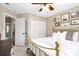 Bedroom with a gold-colored bed frame, neutral walls, and decorative art pieces offering a cozy atmosphere at 3710 Robinson Walk Ct, Marietta, GA 30068