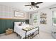 Bedroom with neutral plaid wallpaper, and an iron bed frame, and carpeted floors at 3710 Robinson Walk Ct, Marietta, GA 30068