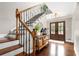 Elegant foyer with wood floors, staircase, decorative table, and double doors at 3710 Robinson Walk Ct, Marietta, GA 30068