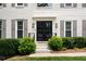 Inviting front entrance featuring a double door, manicured bushes, and stone steps at 3710 Robinson Walk Ct, Marietta, GA 30068