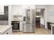 Modern kitchen features stainless steel refrigerator and a wine cooler at 3710 Robinson Walk Ct, Marietta, GA 30068