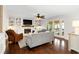 Bright living room features a fireplace, built-in bookshelves, and access to outdoor living at 3710 Robinson Walk Ct, Marietta, GA 30068
