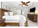 Large primary bedroom with a wooden bed frame at 3710 Robinson Walk Ct, Marietta, GA 30068