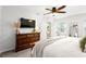 Primary bedroom with a dresser, mounted TV and plenty of natural light at 3710 Robinson Walk Ct, Marietta, GA 30068