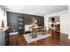Stylish home office with built-in shelving, dark accent wall, and hardwood floors at 3710 Robinson Walk Ct, Marietta, GA 30068