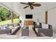 Outdoor living space with comfortable seating, a tv, and a ceiling fan at 3710 Robinson Walk Ct, Marietta, GA 30068