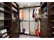 Walk-in closet with custom shelving, drawers, hanging racks, and carpeted floors at 3710 Robinson Walk Ct, Marietta, GA 30068