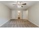 Bedroom featuring neutral paint, carpet floor, a ceiling fan, and a bathroom at 5352 Windfern Ct, Stone Mountain, GA 30088