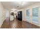 Bright dining area with wood floor and door to backyard at 5352 Windfern Ct, Stone Mountain, GA 30088