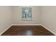 Dining room with hardwood floors, neutral colored walls, and natural lighting at 5352 Windfern Ct, Stone Mountain, GA 30088