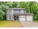 Charming two-story home featuring a two-car garage and inviting front porch at 5352 Windfern Ct, Stone Mountain, GA 30088