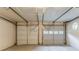A two car garage with two white garage doors at 5352 Windfern Ct, Stone Mountain, GA 30088
