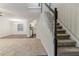 Open-concept living area with stairs to the second floor and eat-in kitchen at 5352 Windfern Ct, Stone Mountain, GA 30088