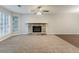 Spacious living room with carpet and fireplace at 5352 Windfern Ct, Stone Mountain, GA 30088