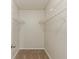 Walk-in closet with carpet flooring and metal shelving at 5352 Windfern Ct, Stone Mountain, GA 30088