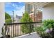 Enjoy city views from this balcony with lush potted plants and black metal railings at 1075 Peachtree Walk # A-307, Atlanta, GA 30309