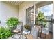 Relax on this cozy balcony with a seating area surrounded by potted plants, offering urban views at 1075 Peachtree Walk # A-307, Atlanta, GA 30309