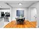 Bright dining area next to the kitchen features hardwood floors and is adjacent to the open kitchen at 1075 Peachtree Walk # A-307, Atlanta, GA 30309