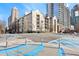 Apartment building exterior in a city setting, featuring several floors and balconies at 1075 Peachtree Walk # A-307, Atlanta, GA 30309