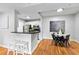 An open kitchen design with a breakfast bar, granite countertops, and stainless steel appliances at 1075 Peachtree Walk # A-307, Atlanta, GA 30309