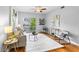 Inviting living room featuring hardwood floors, comfortable seating, balcony, and stylish decor at 1075 Peachtree Walk # A-307, Atlanta, GA 30309