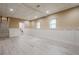 Spacious finished basement with access to laundry, stairs and natural light from two windows at 1137 Poplar Log Pl, Austell, GA 30168