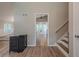Foyer leads to open floor plan, staircase, and view into eat-in kitchen at 1137 Poplar Log Pl, Austell, GA 30168