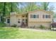 Charming home featuring a well-manicured lawn, neutral siding, and updated windows at 1137 Poplar Log Pl, Austell, GA 30168