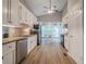 Bright kitchen featuring stainless steel appliances, white cabinets, and an adjacent dining area at 1137 Poplar Log Pl, Austell, GA 30168