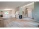 Open concept living space with sleek hardwood floors, modern lighting, and wainscoting detail at 1137 Poplar Log Pl, Austell, GA 30168