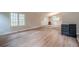 Spacious living room area featuring wood-style floors and a neutral color scheme at 1137 Poplar Log Pl, Austell, GA 30168