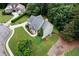 Aerial view of a beautiful home with a manicured lawn, mature trees, and a quiet neighborhood at 12 Isabella Ne Ct, Cartersville, GA 30121