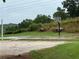 A lush backyard featuring a private basketball court and sandy volleyball area at 12 Isabella Ne Ct, Cartersville, GA 30121