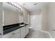 Bathroom featuring a tiled shower and floors, vanity with a solid countertop, and a commode at 12 Isabella Ne Ct, Cartersville, GA 30121