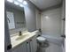 Bathroom features a tiled shower and floors, a single sink vanity, and a toilet at 12 Isabella Ne Ct, Cartersville, GA 30121