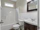 Bathroom with bathtub and a wooden vanity with a white sink at 12 Isabella Ne Ct, Cartersville, GA 30121