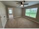 Neutral bedroom with a ceiling fan, closet, and natural light from the window at 12 Isabella Ne Ct, Cartersville, GA 30121
