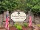 Welcome to Rowland Springs Estates! A beautiful community entrance with American flags at 12 Isabella Ne Ct, Cartersville, GA 30121
