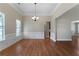 Elegant dining room with wood floors, wainscoting, and a chandelier at 12 Isabella Ne Ct, Cartersville, GA 30121