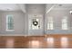 Bright and airy foyer featuring hardwood floors, a front door with sidelights, and an open floor plan at 12 Isabella Ne Ct, Cartersville, GA 30121