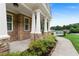 Inviting front porch with stone accents, manicured landscaping, and a walkway leading to the entrance at 12 Isabella Ne Ct, Cartersville, GA 30121