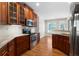 Bright kitchen features stainless steel appliances and access to the outdoors at 12 Isabella Ne Ct, Cartersville, GA 30121